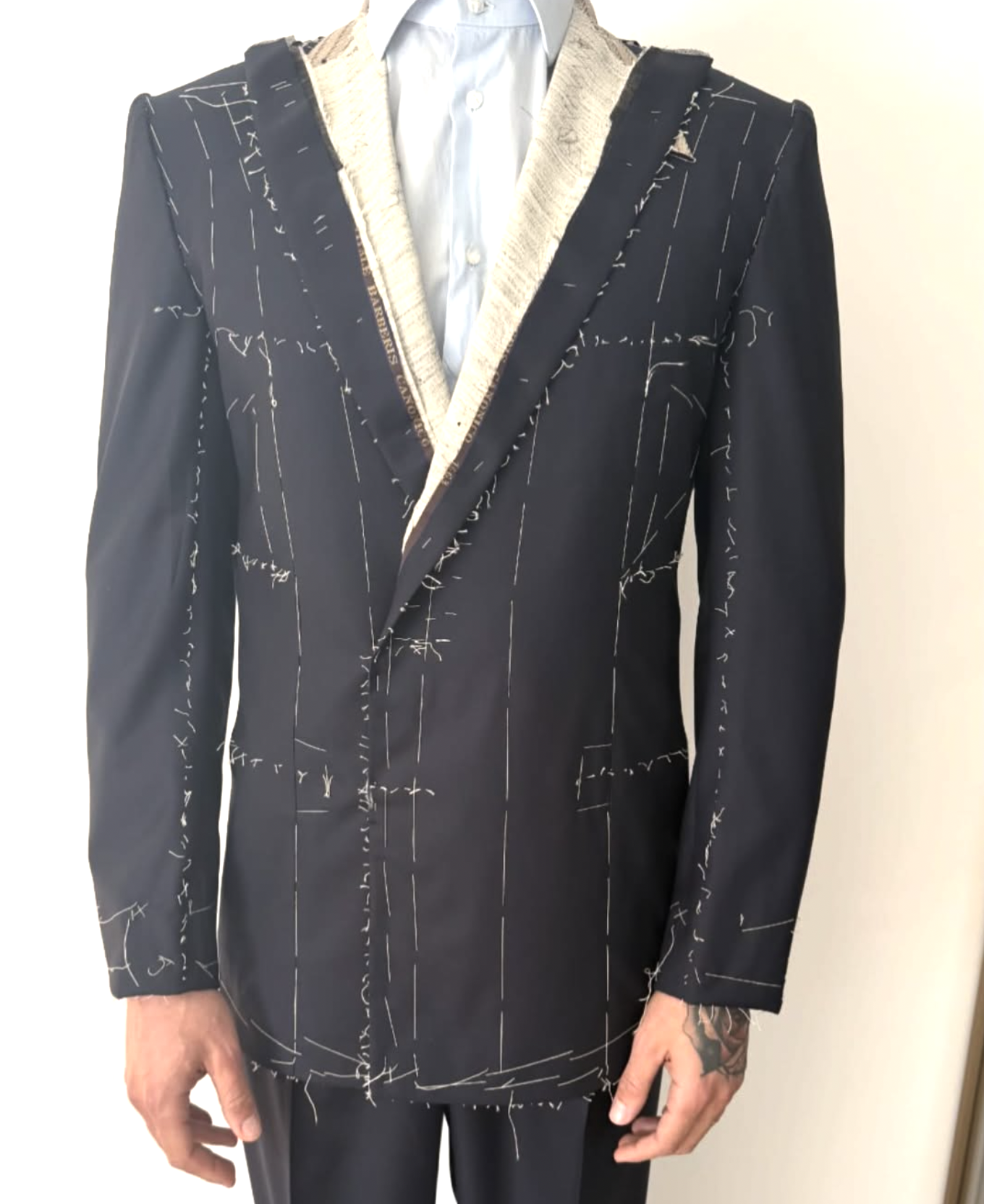 Bespoke suit in basting construction