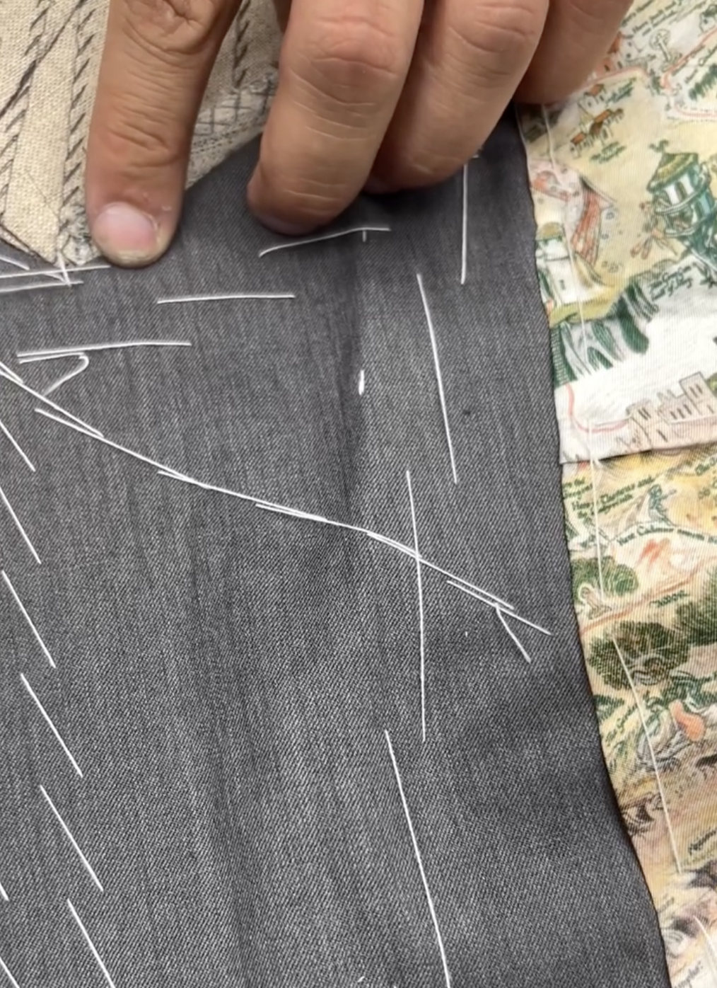 Hands at work on the cloth