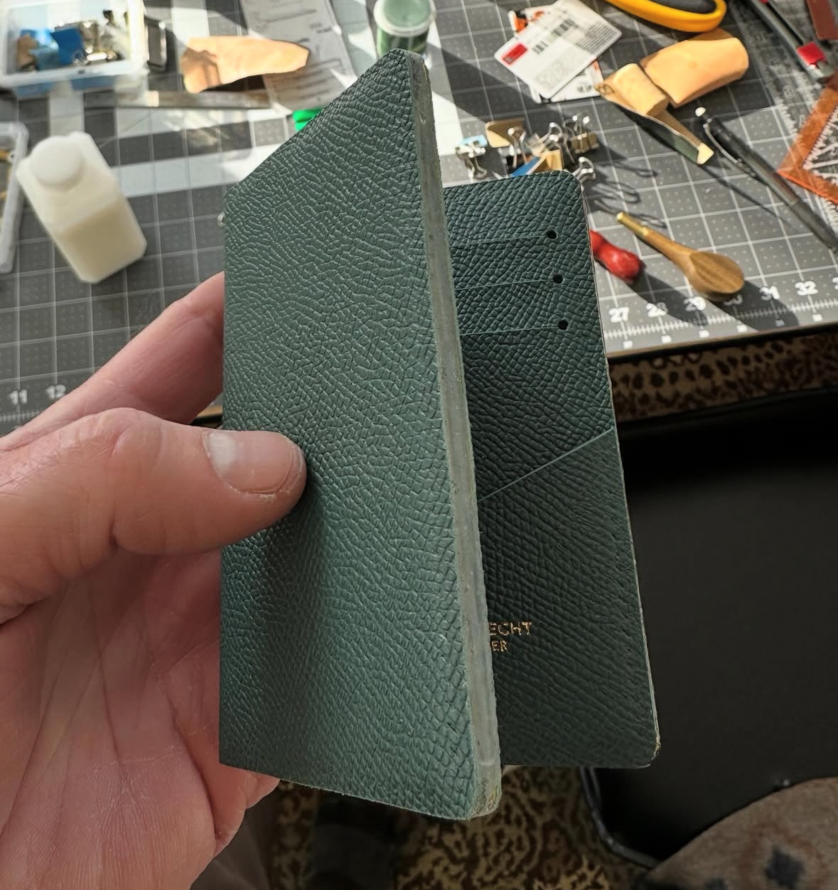 Passport cover spine construction